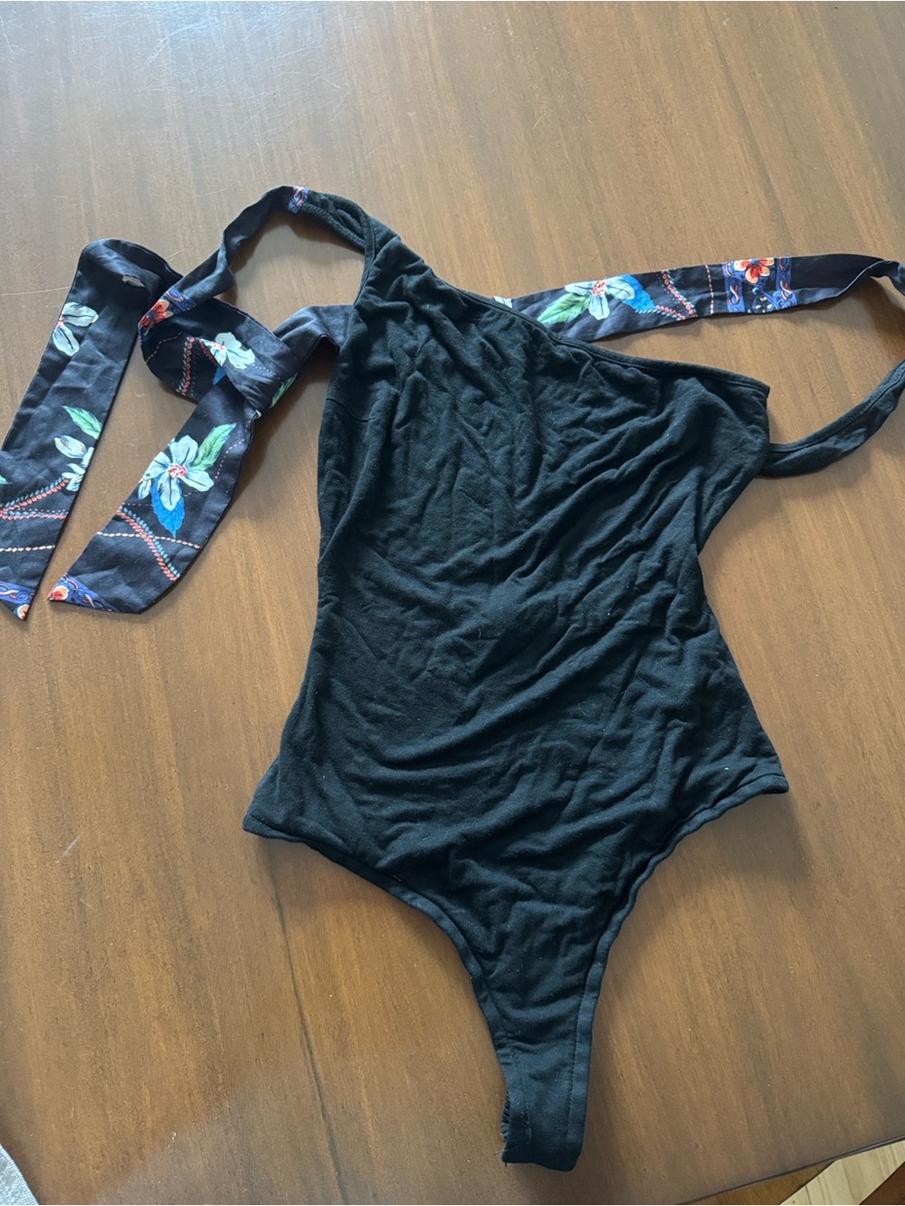 Lulu’s one shoulder bodysuit with floral tie accent